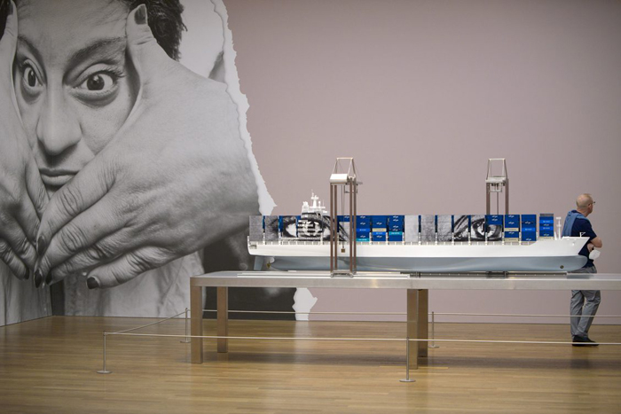 Wall pasting of “Giants, Kikito,” 2017 Tecate, Mexico (left), the Kunsthalle München trompe-l’œil (center), framed artwork of “JR Au Louvre & Le Secret de la Grande Pyramide,” Paris, 2019 (right). 