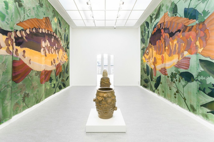 View of Daniel Dewar and Grégory Gicquel, The Wet Wing, Z33, Hasselt, Belgium, 2025. Foreground: Stoneware jar with body fragments and snails, 2024. Background: Silk painting with mirror carp, common water-crowfoot, pondweed and duckweed, 2025. Commissioned by Z33. Courtesy of the artists. Photo: Lola Pertsowsky.