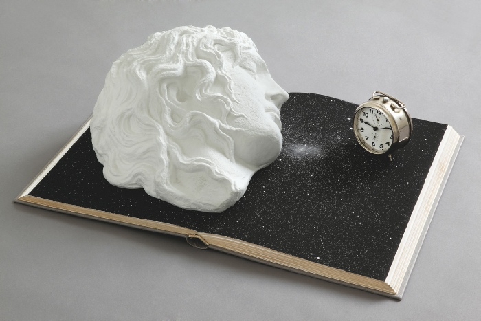 Claudio Parmiggiani, Senza Titolo, 2009. Book, plaster and clock, 51.5 x 74.4 x 26 cm. Courtesy the artist and Meessen De Clercq, Brussels. 