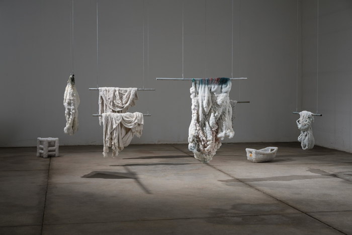 Sigalit Landau, Littoral, 2017.  Readymades (stool, fishing nets, crocheted tablecloths, woven wicker cradle), coated in salt crystals. Photo: Yotam From.